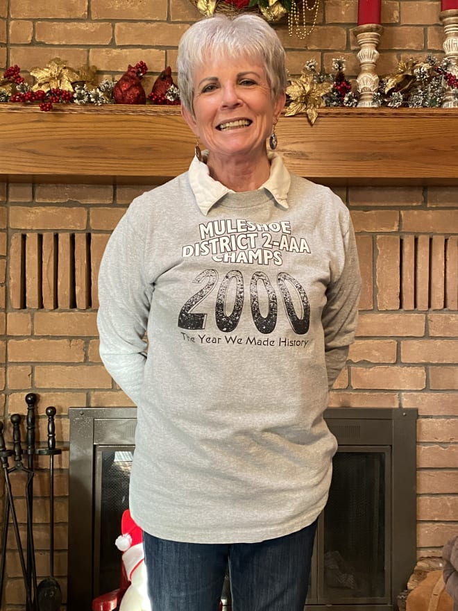 Alice Liles, Lincoln Riley's junior year English teacher at Muleshoe High School, wearing the shirt from the Mules' 2000 state semifinals season.