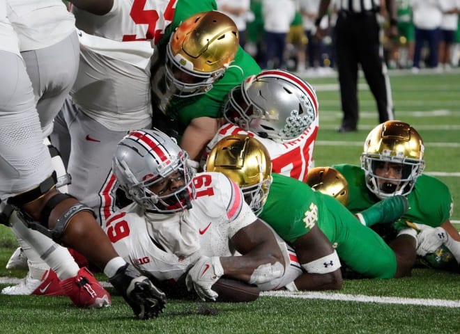 Ohio State's Chip Trayanum, front, scores the game-winning touchdown last weekend. 