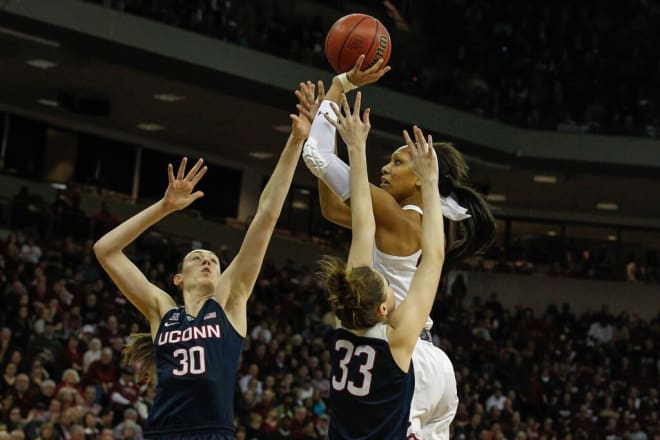 A'ja Wilson takes a shot over two UConn defenders