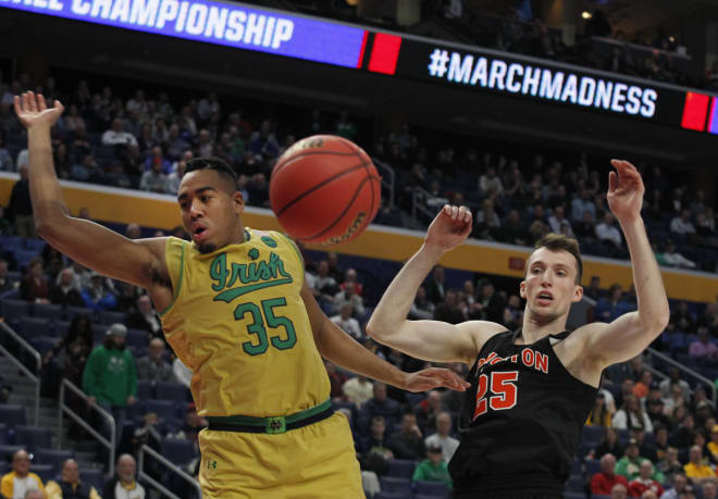 Notre Dame junior forward Bonzie Colson (left) and Princeton forward Steven Cook go for the loose ball during the first half of Thursday's NCAA Tournament game in Buffalo, N.Y.