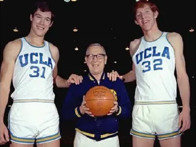 Former UCLA Coach John Wooden with Bruins greats Swen Nater (left) and Bill Walton (right) in 1973.