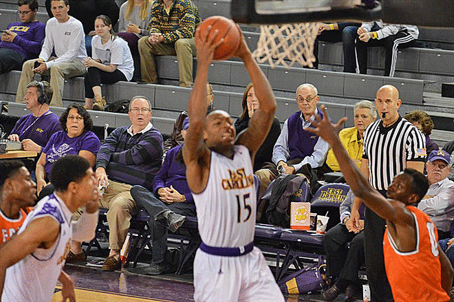 Kentrell Barkley drives on Florida A&M's Desmond Williams in East Carolina's 82-62 victory.