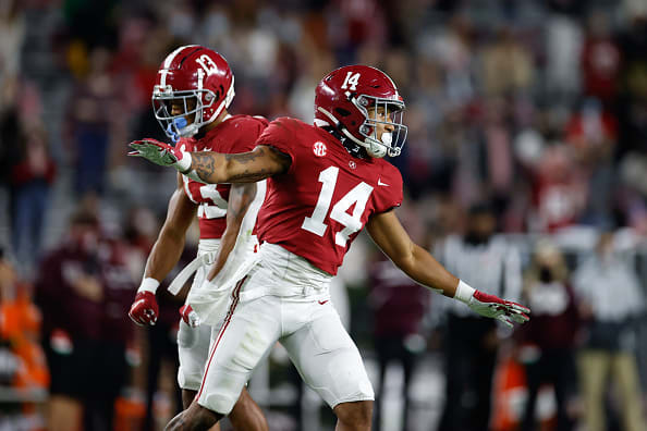 Alabama Crimson Tide defensive backs Brian Branch (14) and Malachi Moore (13) celebrate a defensive play last season. Photo | Getty Images 