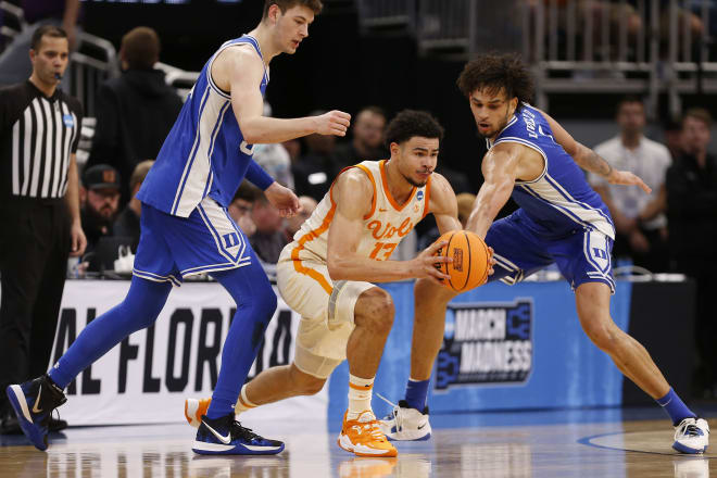 Tennessee forward Olivier Nkamhoua (13) splits two Duke defenders in the Vols' Second Round win in Orlando last week.