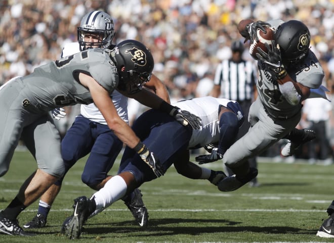 Travon McMIllian dives for a first down.