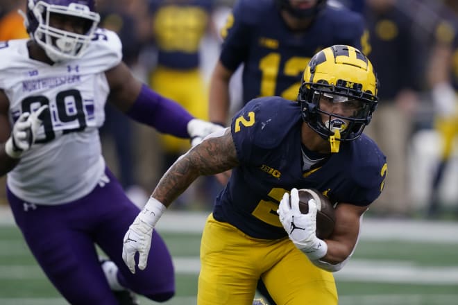 Blake Corum ran for 119 yards and two TDs to lead Michigan.