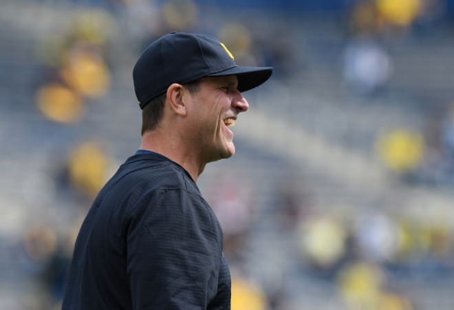 Michigan Wolverines football coach Jim Harbaugh is expected back in Ann Arbor Tuesday. 