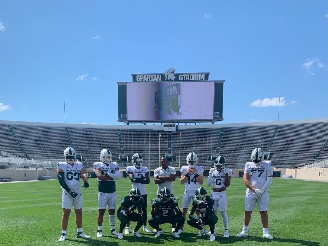 Several of Michigan State's class of 2024 commits pose with Michigan State head coach Mel Tucker at Spartan Stadium during the "Spartan Dawg Con" event (Photo courtesy of Andrew Dennis) 