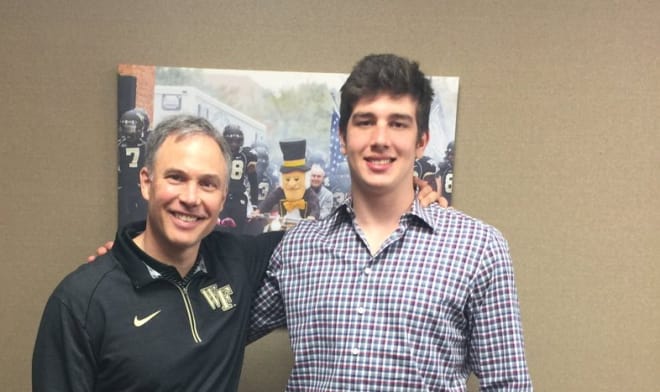 Coach Clawson and Whiteheart celebrate his commitment last week