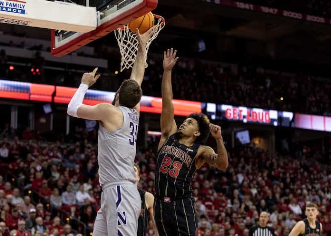 Wisconsin guard Chucky Hepburn goes up for a block against Northwestern 