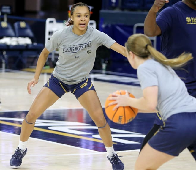 Notre Dame freshman point guard Hannah Hidalgo (left) runs a defensive drill Tuesday during ND women's basketball practice at Purcell Pavilion.