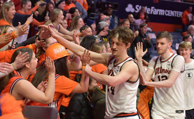 Players high-five fans after Illinois' 66-62 win over Northwestern on Thursday night.