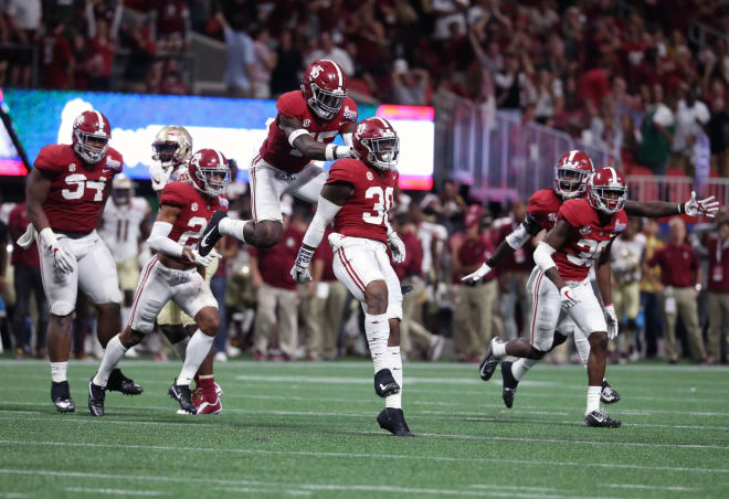 Alabama Crimson Tide linebacker Mack Wilson (30) celebrates his interception with defensive back Ronnie Harrison (15) in the 4th quarter against the Florida State Seminoles at Mercedes-Benz Stadium. Photo | USA Today