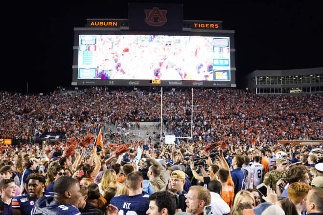 Auburn fans storm the field following the 2019 Iron Bowl.