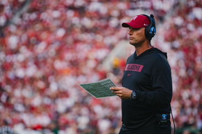 Alabama Crimson Tide head coach Kalen DeBoer reviews a checklist during a timeout in the first quarter at Bryant-Denny Stadium. Photo | William McLelland-Imagn Images