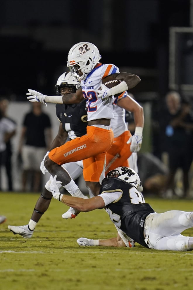 Boise State cornerback Tyric LeBeauf (22) runs back an interception, trying to get past Central Florida tight end Jake Hescock during the second half of an NCAA college football game early Friday, Sept. 3, 2021, in Orlando, Fla. (AP Photo/John Raoux)