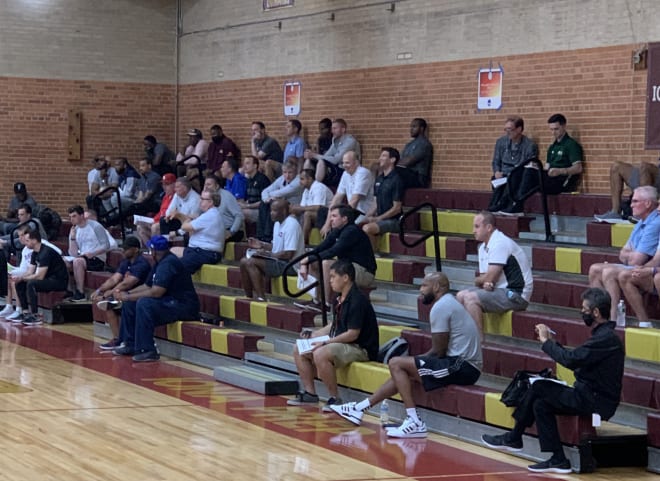 D-I and D-II college coaches watch the games intently