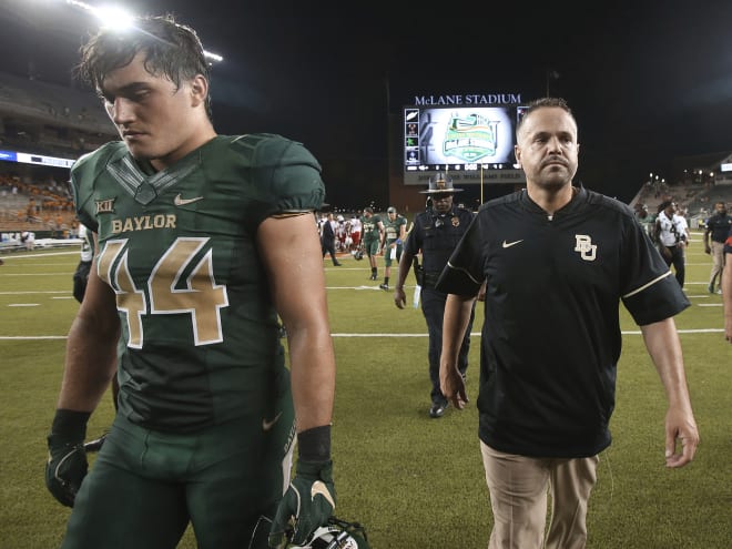 Matt Rhule (right) and Clay Johnston fell to Liberty 48-45.