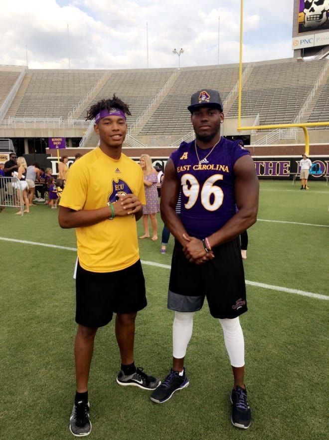South Central defender Jeremy Lewis pictured with his brother Kiante Anderson this spring in Dowdy-Ficklen Stadium.