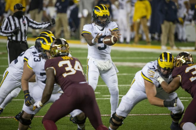 Michigan Wolverines football quarterback Joe Milton ran for a touchdown and threw for a score in his team's season-opening win at Minnesota.