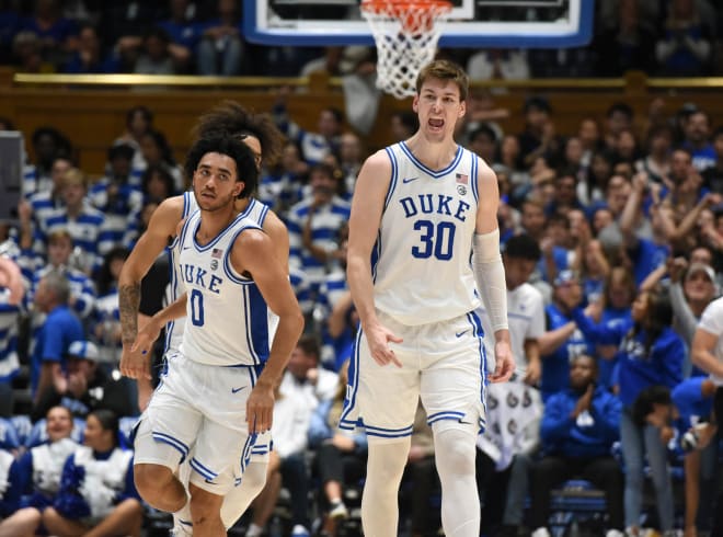 Duke's Kyle Filipowski, right, and Jared McCain react during the second half of Friday night's blowout win against Bucknell. 