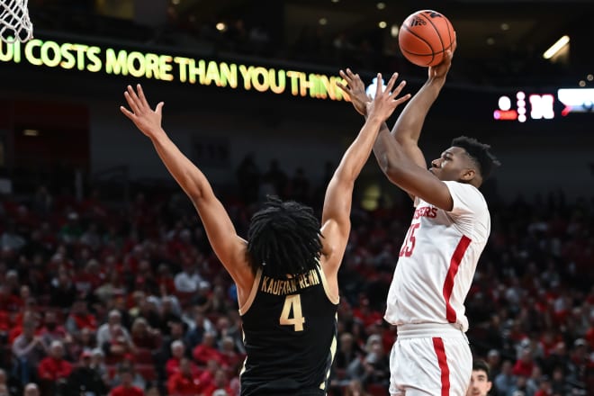 Dec 10, 2022; Lincoln, Nebraska, USA; Nebraska Cornhuskers guard Emmanuel Bandoumel (25) scores over Purdue Boilermakers forward Trey Kaufman-Renn (4) in the first half at Pinnacle Bank Arena. Mandatory Credit: Steven Branscombe-USA TODAY Sports