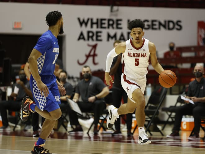 Alabama basketball guard Jaden Shackelford dribbles the ball down the court. Photo | SEC