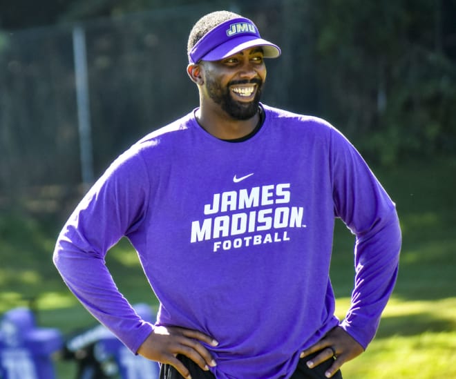 James Madison inside receivers coach and recruiting coordinator Fontel Mines watches an August practice.