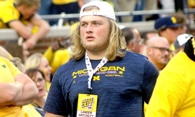 Washington offensive lineman Landen Hatchett holds a Michigan Wolverines football recruiting offer 