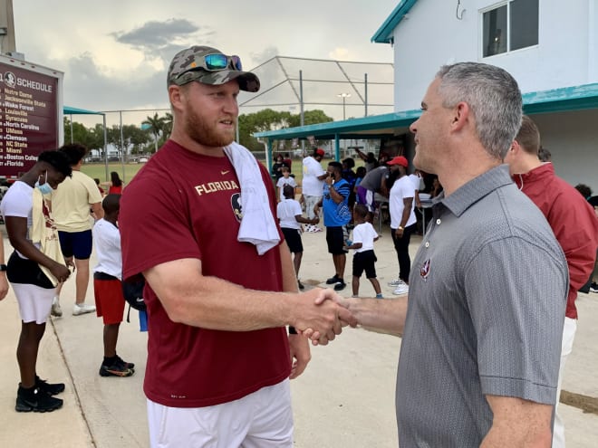 FSU coach Mike Norvell greets former Seminole star and current NFL tight end Nick O'Leary on Thursday.