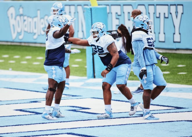 In just his third year playing football, Kevin Hester (98) got 126 snaps for the Heels last fall.