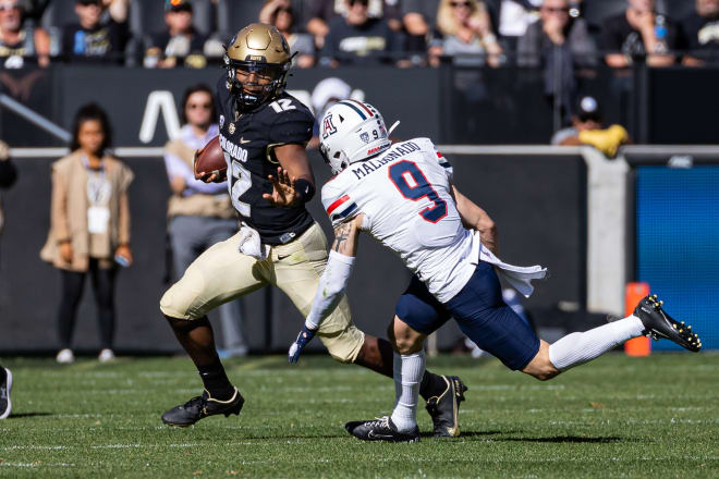 Brendon Lewis evades Arizona's Gunner Maldonado during a 34-0 win over the Wildcats last Saturday 