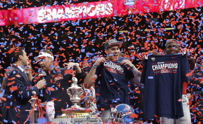 Ole Miss coach Hugh Freeze, quarterback Chad Kelly and wide receiver Laquon Treadwell celebrate the Rebels' 48-20 win over Oklahoma State in the Allstate Sugar Bowl Friday night in New Orleans.