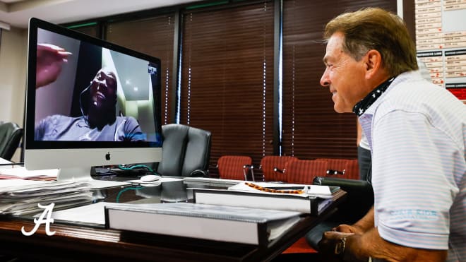 Alabama head coach Nick Saban, right, watches as Michael Jordan speaks to the Crimson Tide football team. Photo | Alabama Athletics 