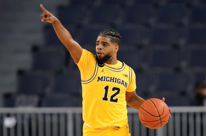 Michigan Wolverines basketball senior guard Mike Smith has led the Wolverines at the point this year.