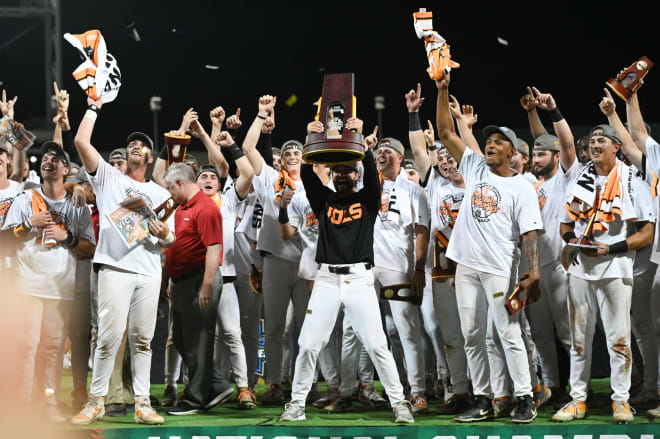 Jun 24, 2024; Omaha, NE, USA; Tennessee Volunteers head coach Tony Vitello holds the national championship trophy after the win against the Texas A&M Aggies at Charles Schwab Field Omaha. 