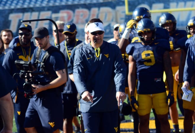 The West Virginia Mountaineers football coaches are in various spots on game days. 