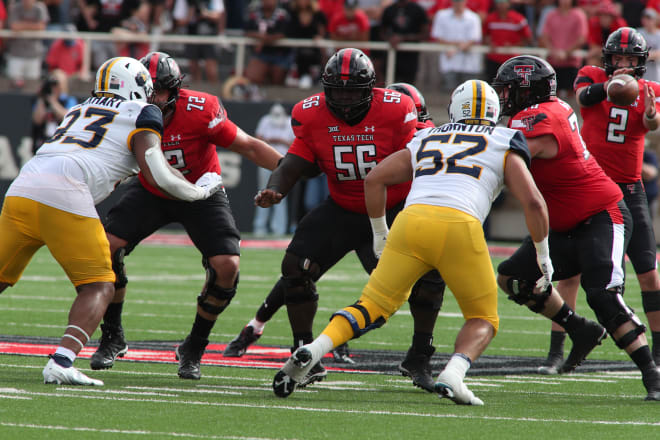 Wilburn (56) last season against the Mountaineers