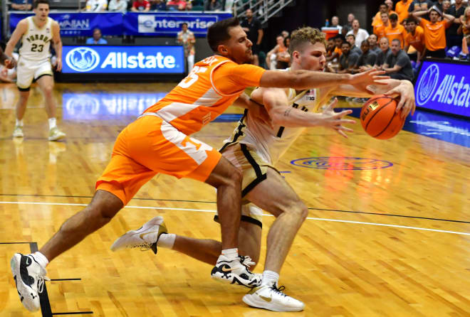 Nov 21, 2023; Honolulu, HI, USA; Tennessee Volunteers guard Santiago Vescovi (25) and Purdue Boilermakers forward Caleb Furst (1) fight for the ball during the second period at SimpliFi Arena at Stan Sheriff Center. Mandatory Credit: Steven Erler-USA TODAY Sports