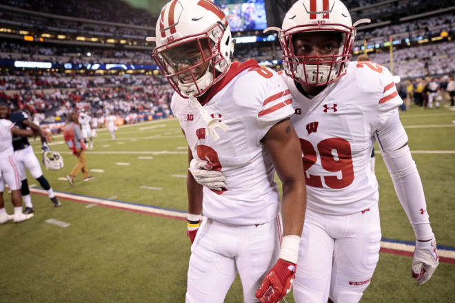 Dontye Carriere-Williams (29) consoles Sojourn Shelton (8) after Wisconsin's loss to Penn State.