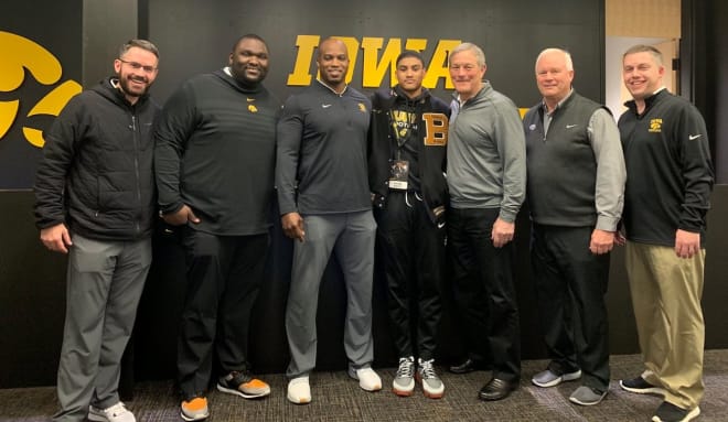 Wide receiver Xavier Watts with the Iowa coaching staff at the Hawkeyes' junior day on Sunday.
