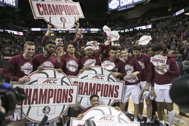 The FSU men's basketball team celebrates its ACC regular-season title last week.