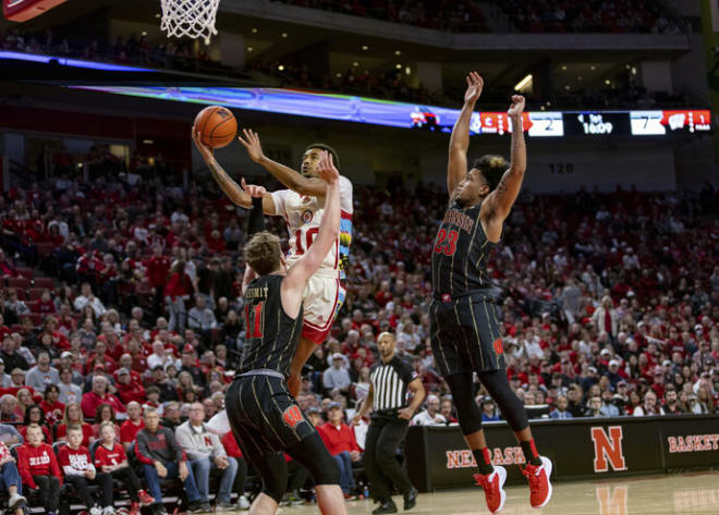 Nebraska's Jamarques Lawrence (10) makes a lay up against Wisconsin's Max Klesmit (11) and Chucky Hepburn (23).