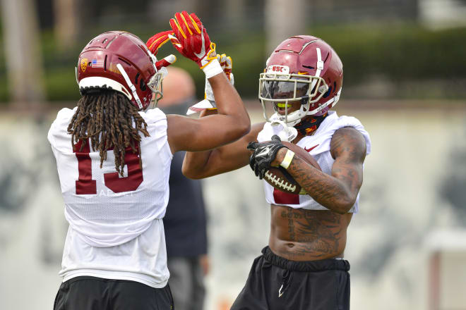 Olaijah Griffin celebrates with redshirt freshman cornerback Adonis Otey.