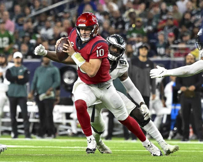 Josh Sweat pressures Davis Mills in the Eagles' win on Thursday night.