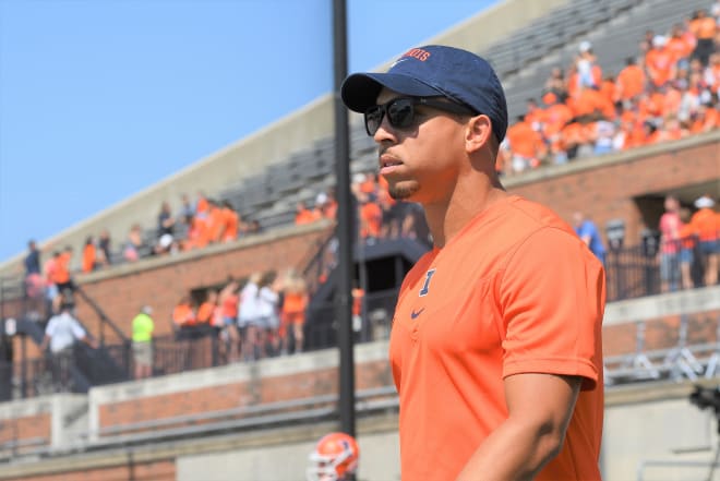  Illinois Fighting Illini defensive coordinator Ryan Walters walks on to the field before the start of the Big Ten Conference college football game between the Nebraska Cornhuskers and the Illinois Fighting Illini on August 28, 2021, at Memorial Stadium in Champaign, Illinois.