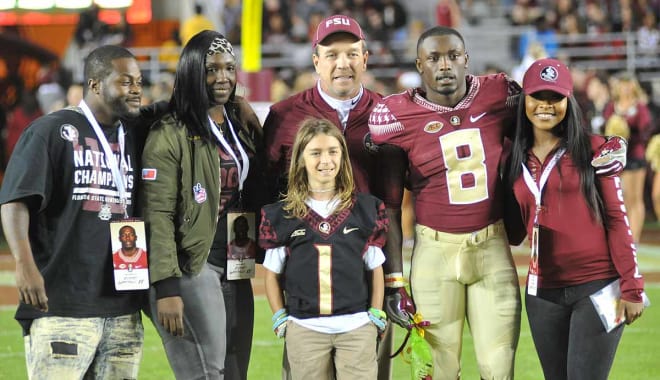 Kermit Whitfield and his family on Senior Day.
