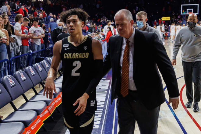 Tad Boyle and K.J. Simpson walk off the court following Thursday night's loss