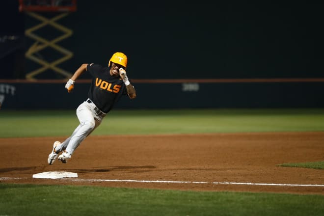 Tennessee shortstop Maui Ahuna rounds third after Hunter Ensley’s go-ahead RBI double against Clemson in the 14th inning on Saturday. 