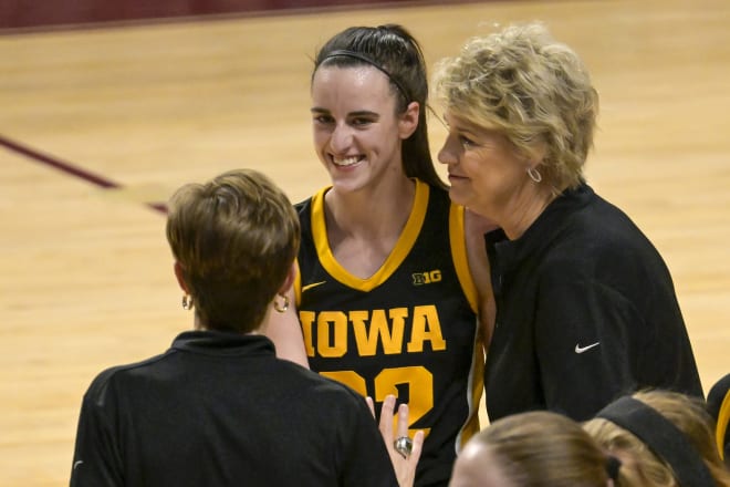 Caitlin Clark shares a moment with head coach Lisa Bluder and associate head coach Jan Jensen during the fourth quarter.